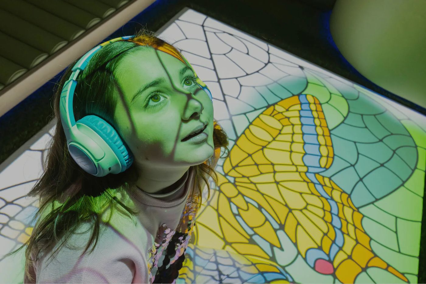 Child in a sensory projection play space